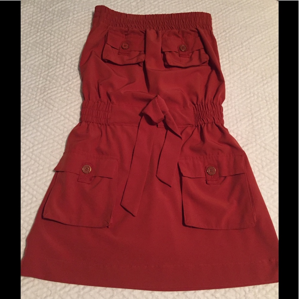 Rust colored strapless dress with gold buttons